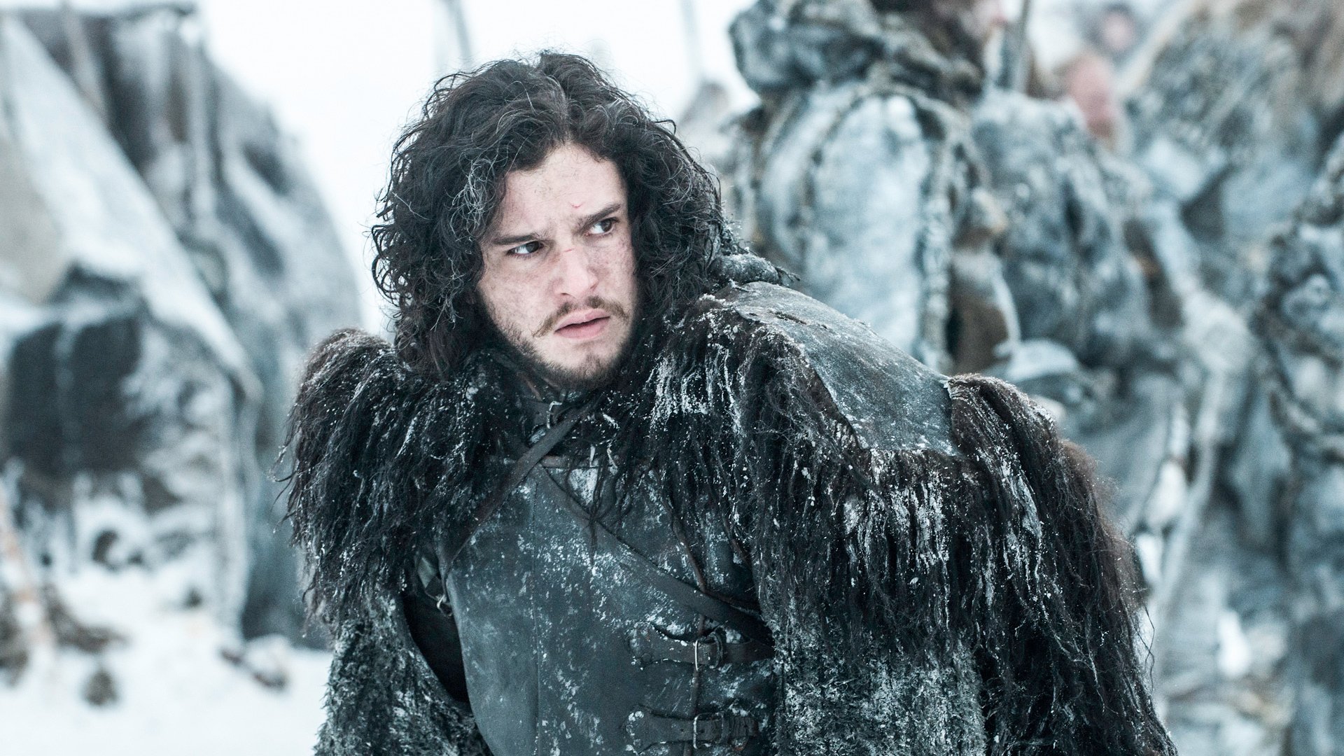 HD PC desktop wallpaper featuring Jon Snow from the TV show Game of Thrones, dressed in black fur with a snowy battlefield background.