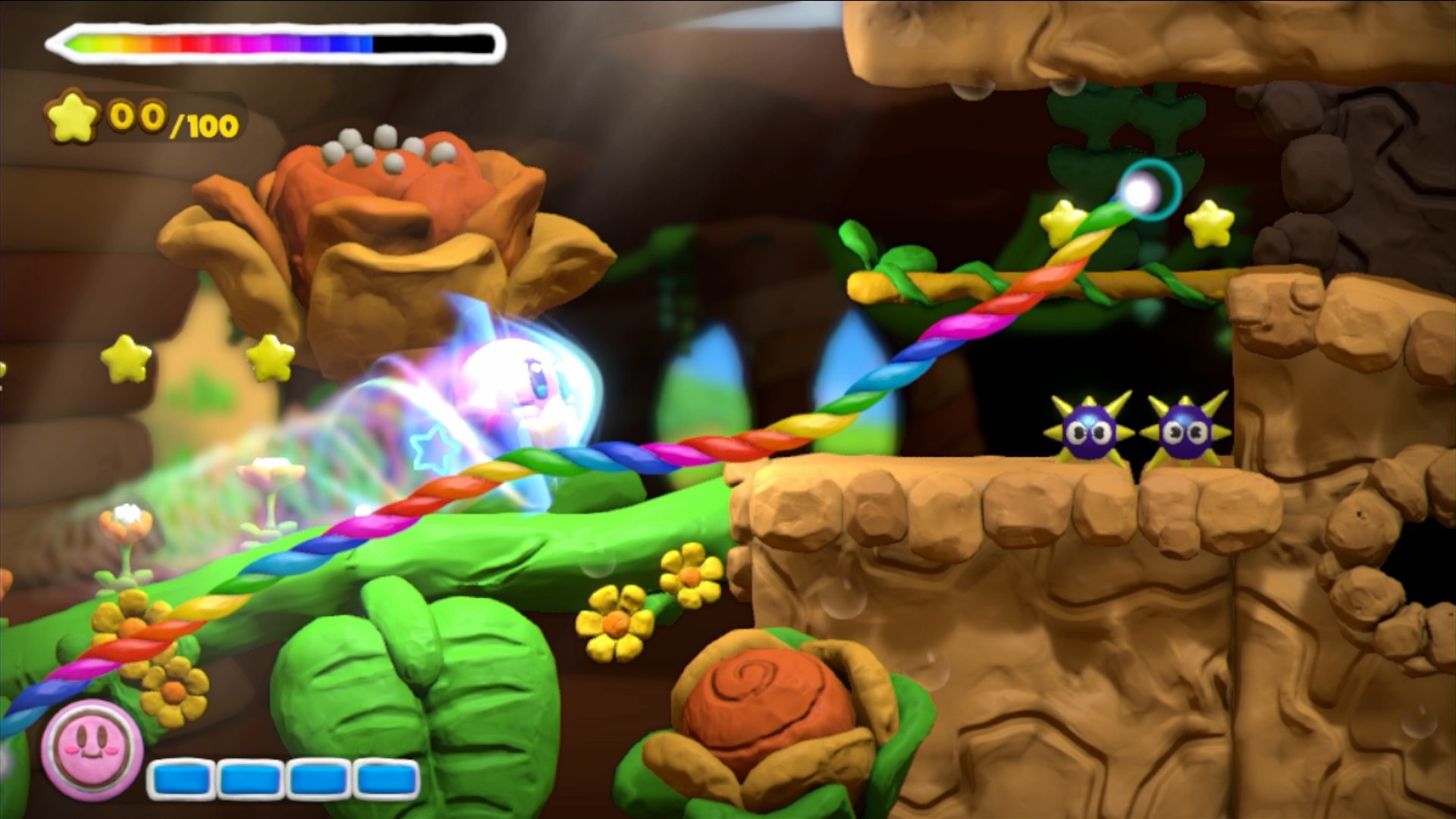 HD desktop wallpaper from Kirby and the Rainbow Curse featuring Kirby in an in-game action scene.