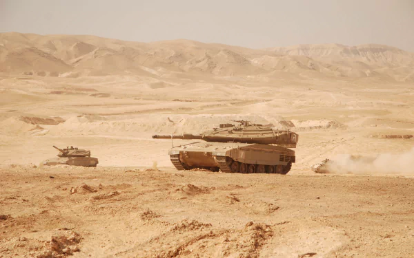 2K Quad HD PC desktop wallpaper showing Merkava main battle tanks traversing a dusty desert landscape, dust clouds trailing behind them.