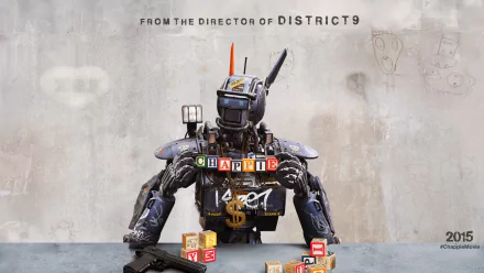 HD desktop wallpaper featuring Chappie, the robot from the movie, sitting with alphabet blocks against a graffiti wall background.