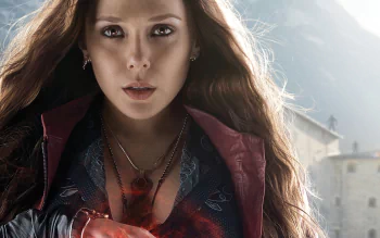HD desktop wallpaper of Elizabeth Olsen as Scarlet Witch from Avengers: Age of Ultron, featuring her with red eyes, long red hair, a necklace, and earrings, performing magic.