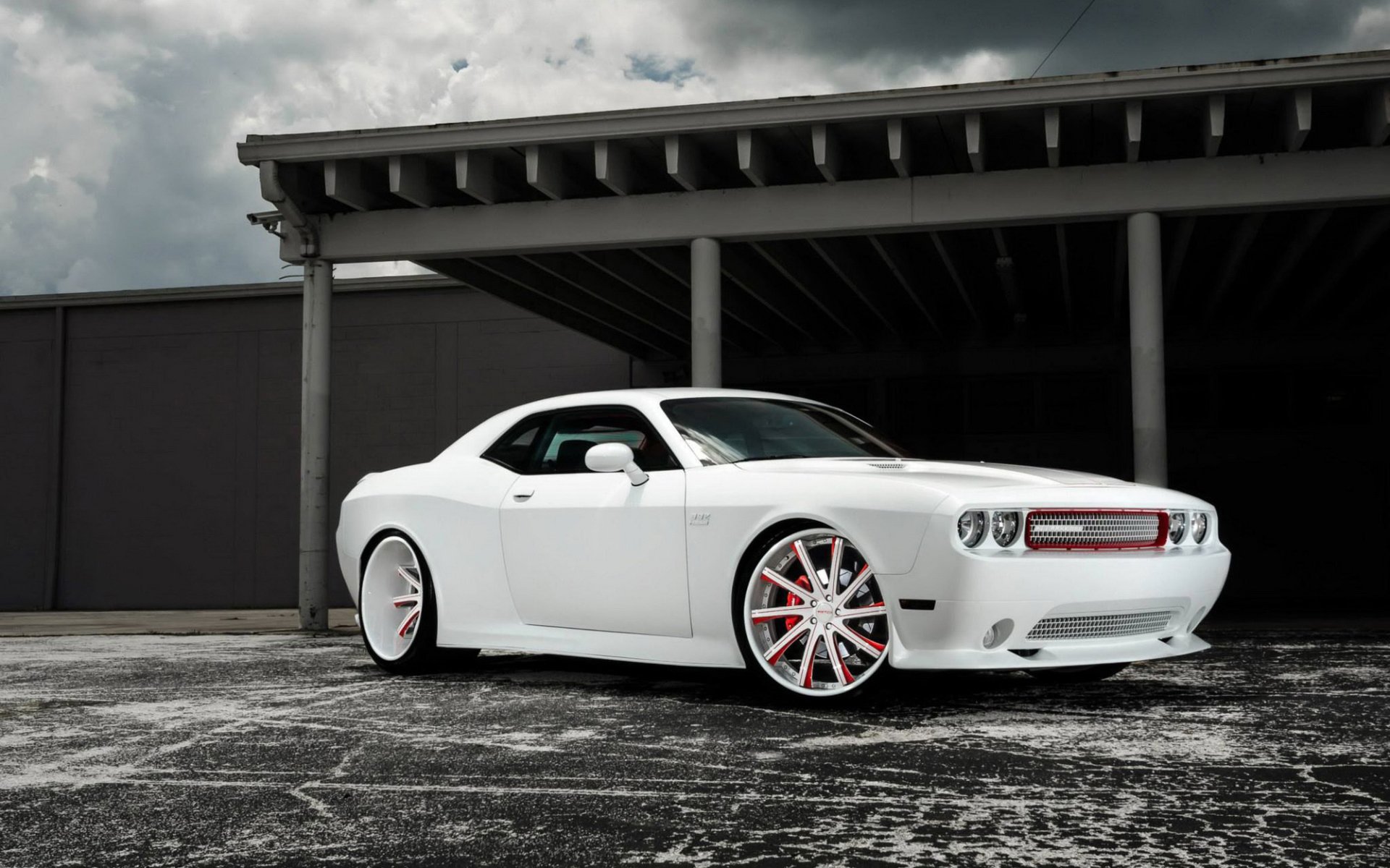 White Dodge Challenger parked under a canopy on a cloudy day, captured in high-definition for a PC desktop wallpaper and background.