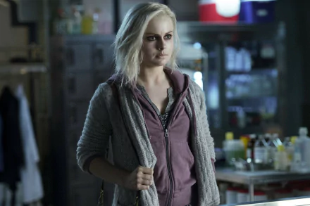 HD PC desktop wallpaper featuring a scene from the TV show iZombie, showing the main character in a dimly lit laboratory setting.