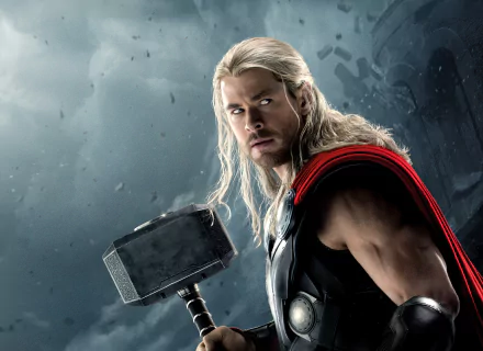 HD desktop wallpaper of Chris Hemsworth as Thor in Avengers: Age of Ultron, with a stormy background, holding Mjölnir.