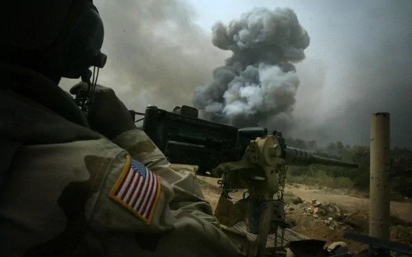 A United States Army soldier stands ready with heavy artillery as a plume of smoke rises in the background, captured in an HD desktop wallpaper and background.