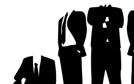 A sleek HD desktop wallpaper featuring anonymous figures in suits, symbolizing technology and modernity with a minimalist black and white design.