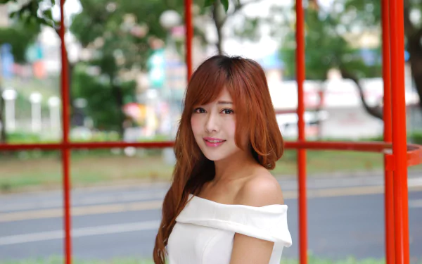 A smiling Asian Taiwanese woman, Xiao Xi, poses outdoors in a white off-shoulder top, featured in a 4K Ultra HD PC desktop wallpaper.