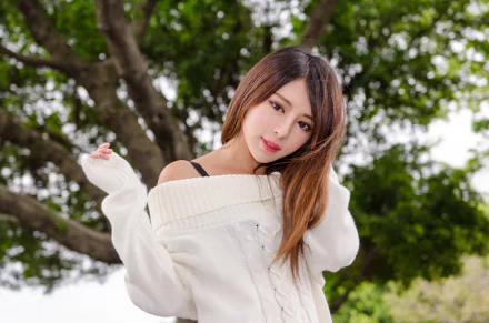 Taiwanese Asian model woman in a white off-shoulder sweater posing outdoors by leafy trees — 4K Ultra HD PC desktop wallpaper.