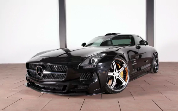 A sleek black Mercedes-Benz SLS AMG displayed in a modern setting, showcasing its dynamic design and striking alloy wheels. HD wallpaper quality for a stunning visual impact.