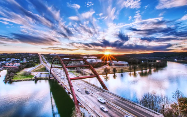 4K Ultra HD wallpaper of Pennybacker Bridge in Austin, Texas at sunset — arched man-made bridge carrying a highway over the river.