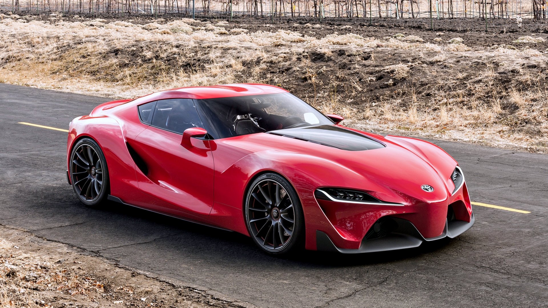 Red Toyota FT-1 concept supercar parked on a road, showcased in stunning 4K Ultra HD as a dynamic PC desktop wallpaper and background.