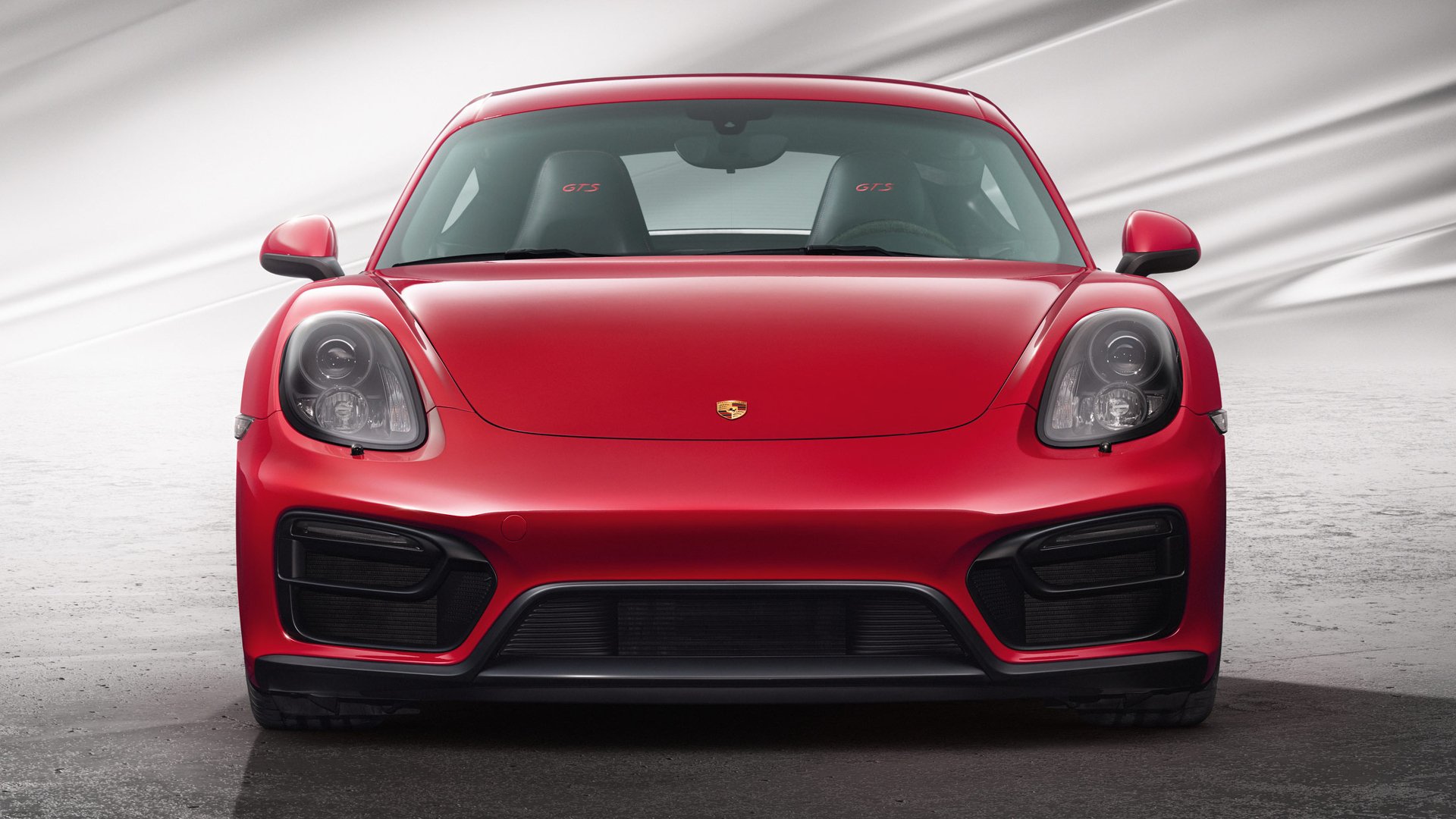 Front view of a red Porsche Cayman GTS vehicle (Porsche Cayman) on a neutral studio backdrop — HD PC desktop wallpaper and background.