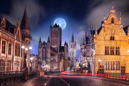 A captivating night scene in Ghent, Belgium, featuring a majestic church under a full moon, framed by historic buildings along a peaceful road.