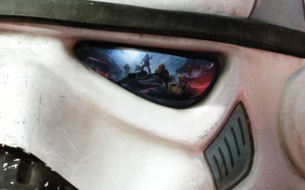 A detailed HD wallpaper featuring a Stormtrooper helmet with a vibrant scene from Star Wars Battlefront (2015) reflected in its eye lens.