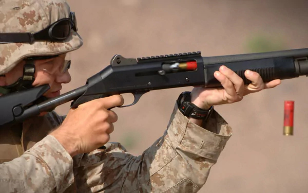HD desktop wallpaper showing a U.S. Army Infantry soldier aiming a shotgun, captured mid-shot with ejected shell visible, highlighting war and military action.