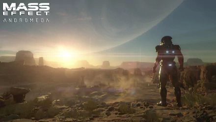 An HD wallpaper from Mass Effect: Andromeda, featuring a lone character in armor gazing at a stunning sunrise over a rugged alien landscape.