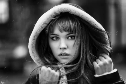 Black and white HD desktop wallpaper featuring a woman wearing a hood in the snow, tagged with model and Anastasiya Scheglova.