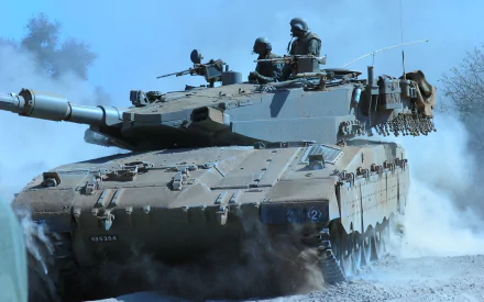 HD desktop wallpaper showing a Merkava military tank advancing through a dusty terrain with soldiers manning the vehicle under a clear sky.