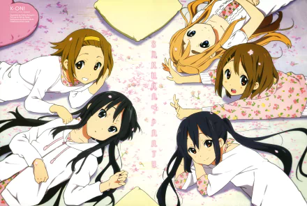 Five characters from K-ON!—Azusa Nakano, Tsumugi Kotobuki, Ritsu Tainaka, Yui Hirasawa, and Mio Akiyama—relax together in a colorful, floral setting, presented as a 4K Ultra HD wallpaper.