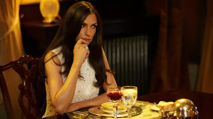 HD PC desktop wallpaper/background: a contemplative woman in elegant dress at a candlelit dinner table, moody lighting and rich tones from the TV show Hemlock Grove.