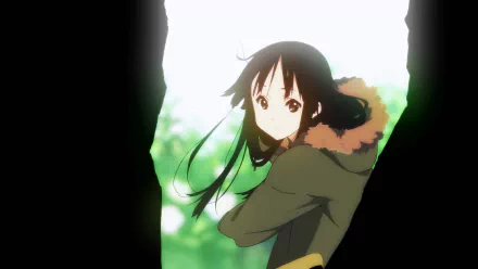 HD PC desktop wallpaper of anime character Mio Akiyama from K-ON!, glancing back amid sunlit green foliage while wearing a fur-lined hooded coat.