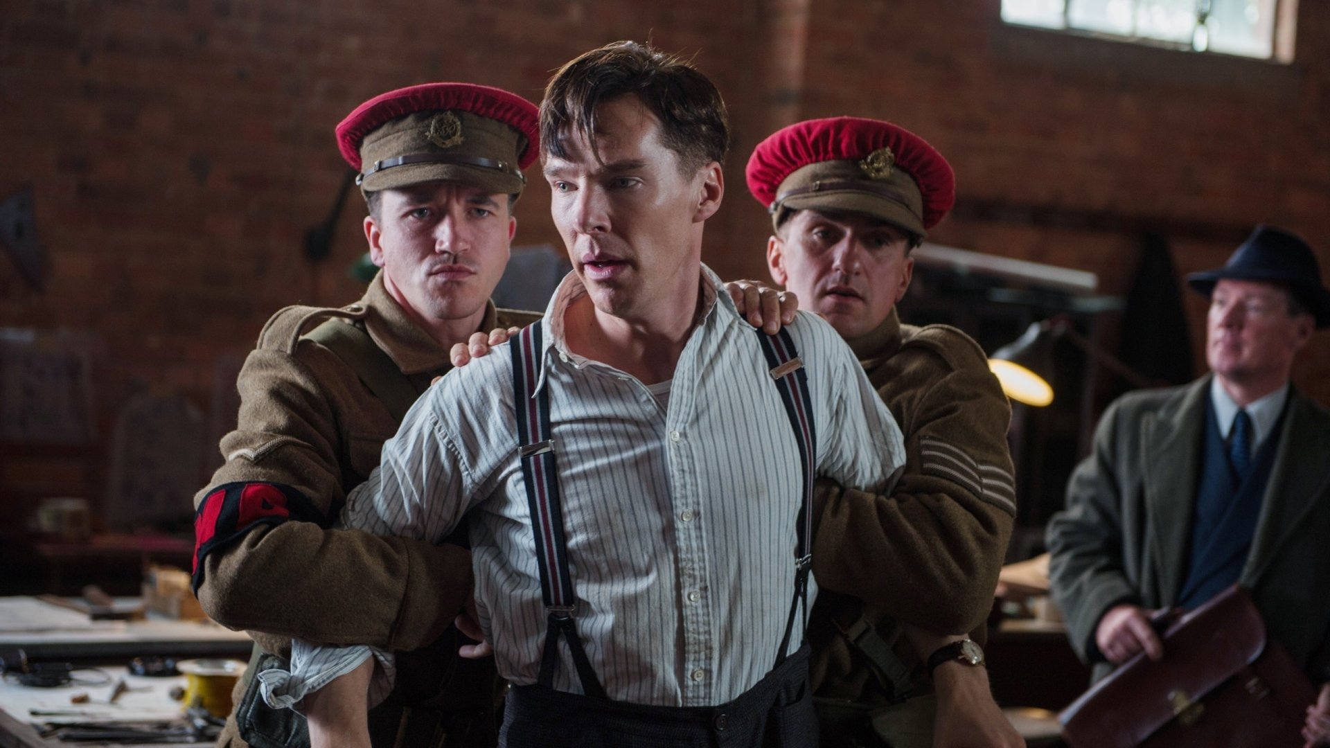 HD PC desktop wallpaper featuring Benedict Cumberbatch in a tense scene from the movie The Imitation Game, surrounded by soldiers in period uniforms.