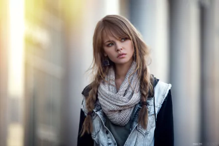 HD desktop wallpaper featuring a brunette woman with braided hair and earrings, wearing a scarf and denim jacket against a bokeh background. The image is tagged with Anastasiya Scheglova, model.