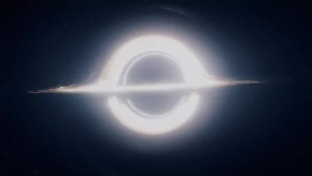 A stunning HD PC desktop wallpaper featuring a black hole, inspired by the movie Interstellar, set against a dark cosmic background.