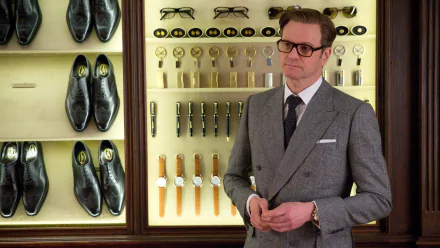Colin Firth stands in a stylish setting featured in Kingsman: The Secret Service, surrounded by elegant shoes and accessories, showcasing a sophisticated atmosphere.