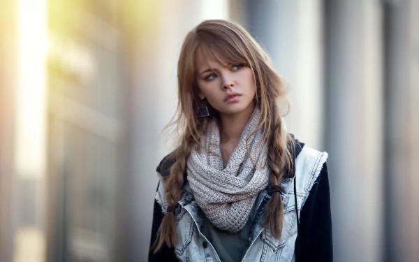 HD desktop wallpaper featuring a brunette woman with braided hair and earrings, wearing a scarf and denim jacket against a bokeh background. The image is tagged with Anastasiya Scheglova, model.