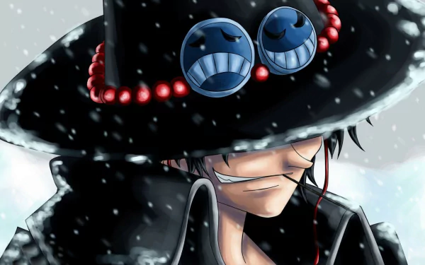 HD wallpaper of Portgas D. Ace from the anime One Piece, featuring him in a snowy scene with a black hat decorated with smiley-face goggles and red beads.
