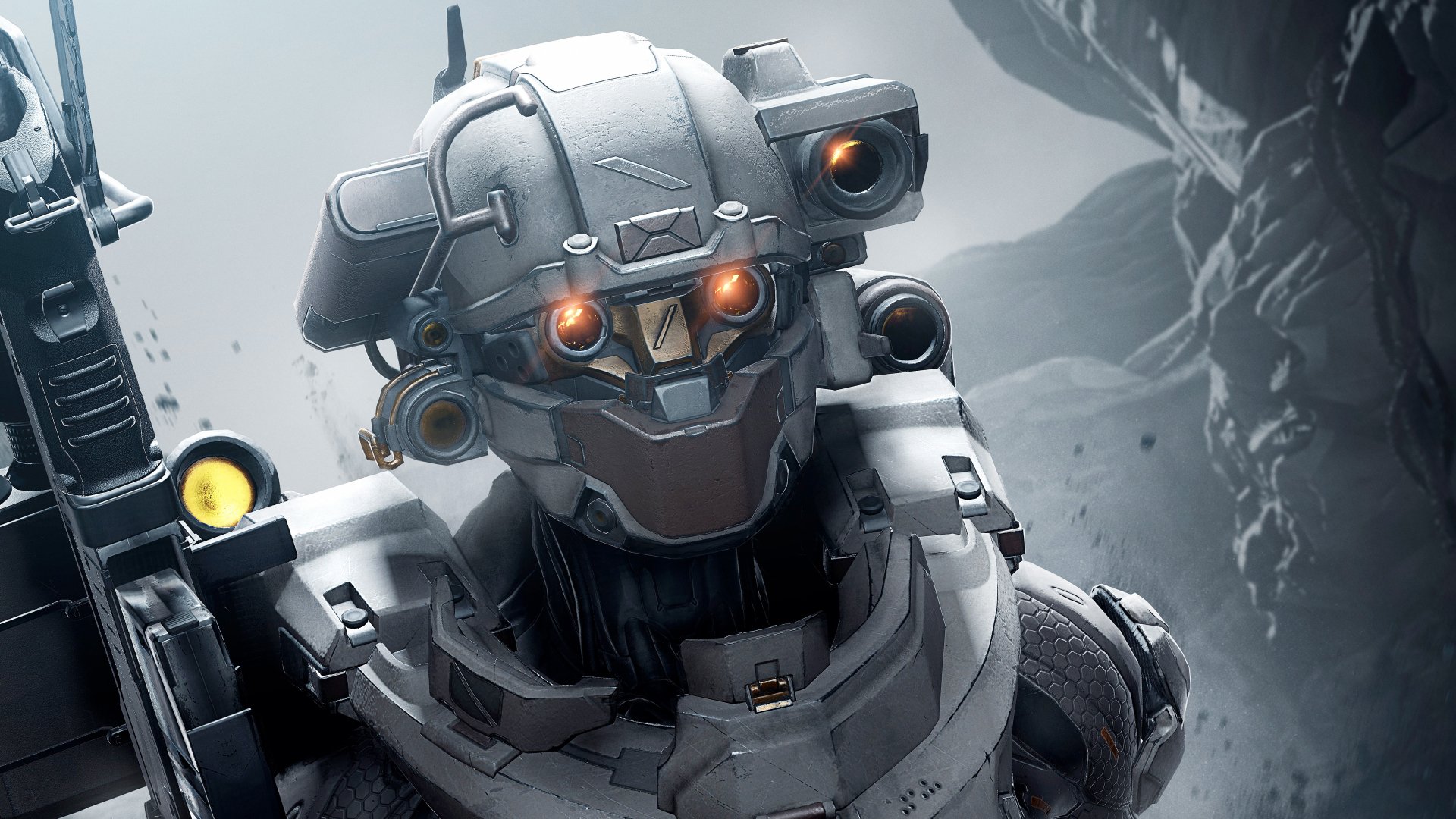 A high-definition desktop wallpaper featuring a detailed image from the video game Halo 5: Guardians, showcasing an armored character against a rugged, rocky background.