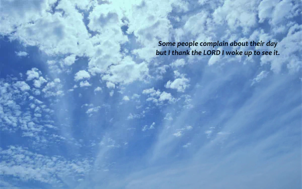 HD desktop wallpaper with a beautiful, bright sky filled with fluffy clouds. Includes the statement, Some people complain about their day but I thank the LORD I woke up to see it, emphasizing a religious and Christian theme.