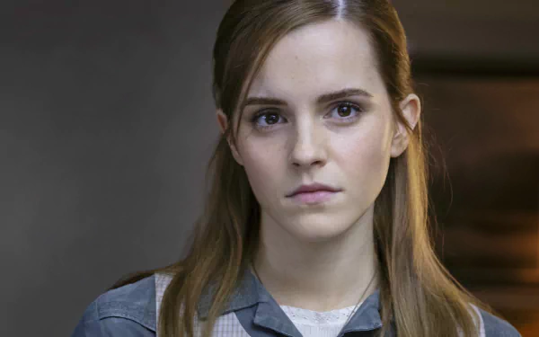 Close-up of a serious young actress from the movie Regression with soft lighting and a neutral background — 2K Quad HD PC desktop wallpaper.