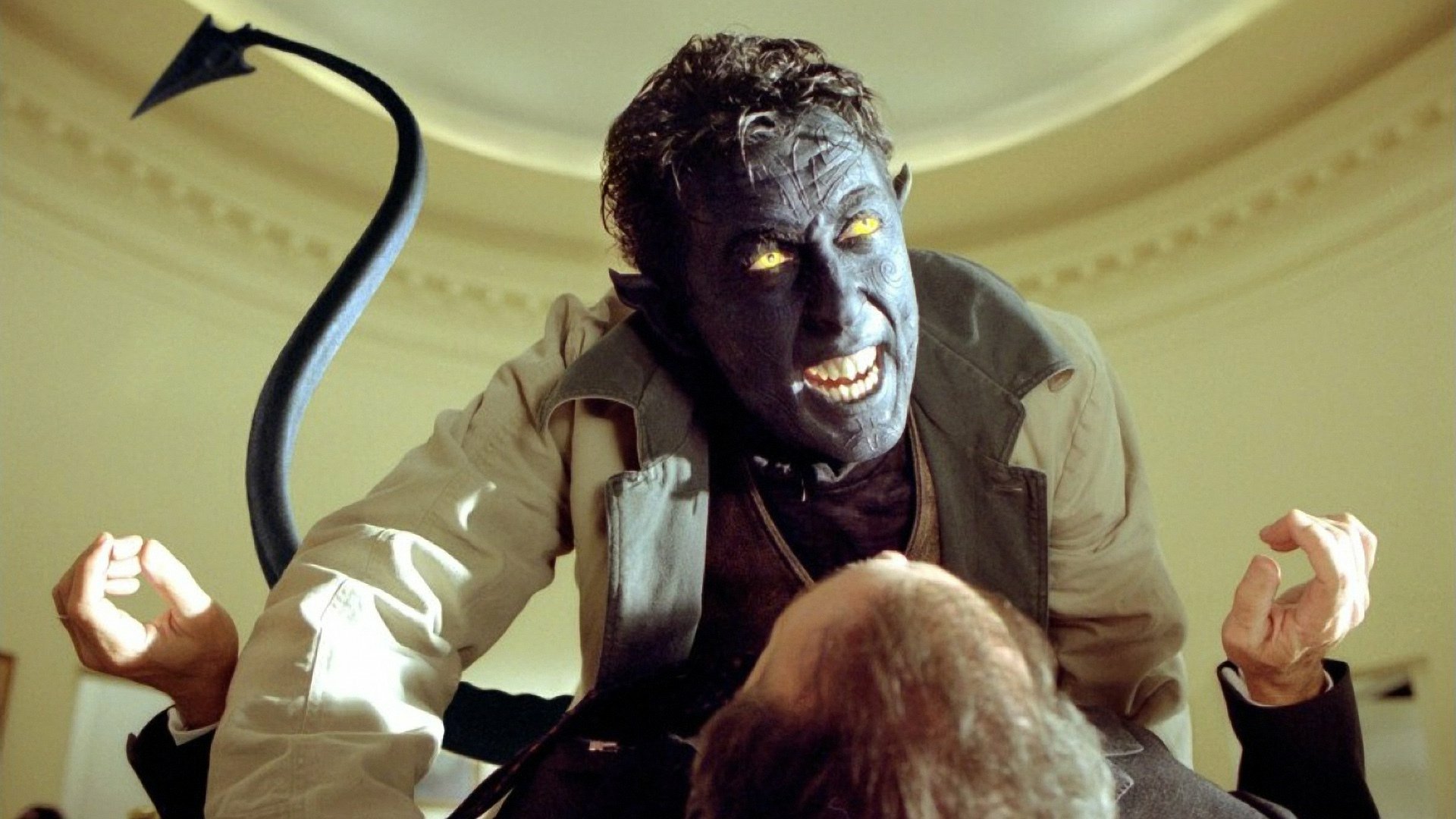 HD PC desktop wallpaper of Nightcrawler (X2: X-Men United) — blue-skinned, glowing-eyed mutant snarling, tail curled, looming over a prone person in a circular-lit room.