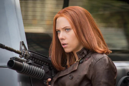 Scarlett Johansson as Black Widow in a gripping scene from *Captain America: The Winter Soldier*, showcasing her determination and strength against a dynamic backdrop.