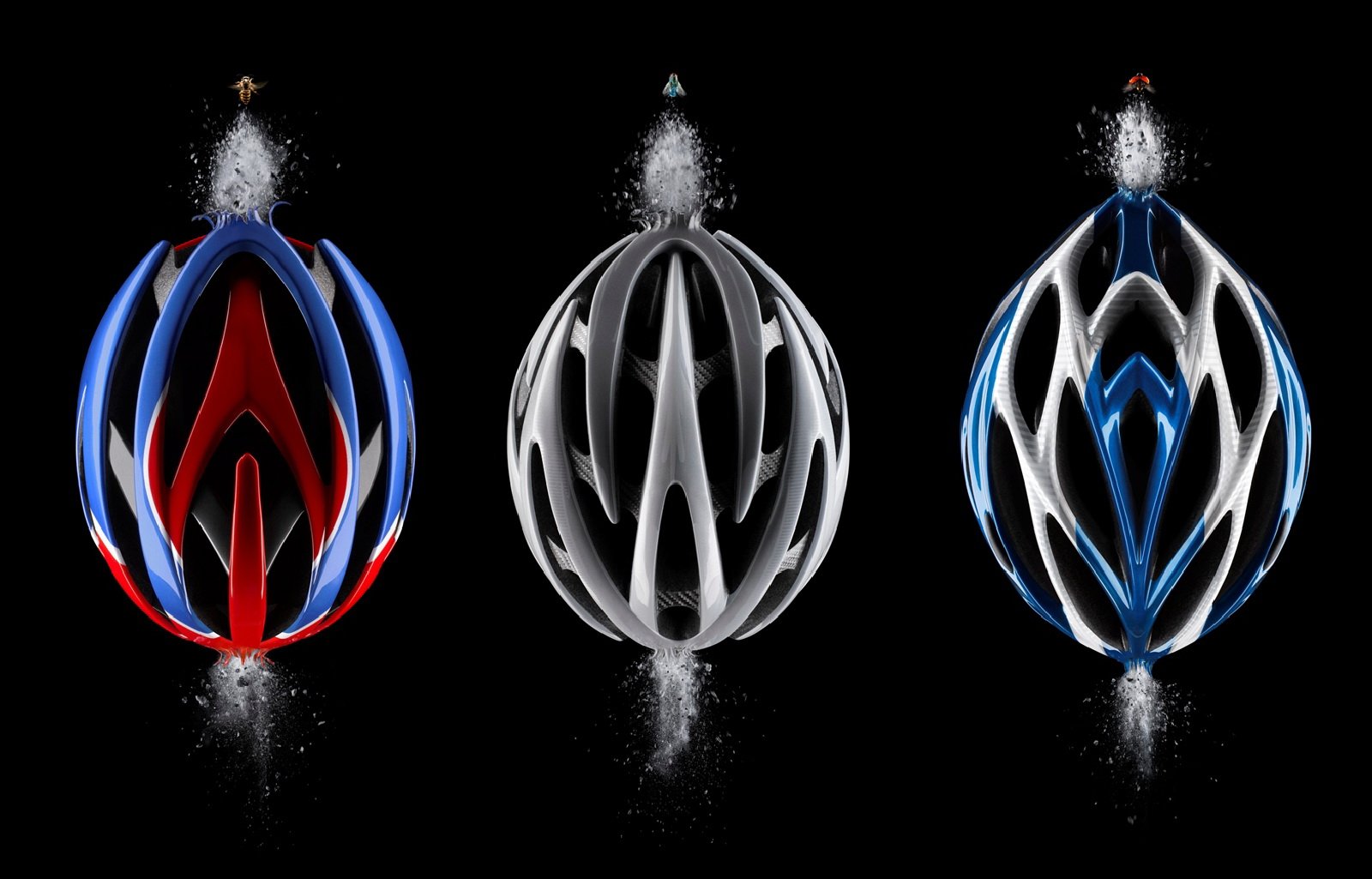 HD PC desktop wallpaper featuring three sleek cycling helmets in red, black, and blue, emphasizing speed and sports performance against a dark background.