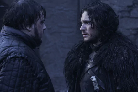 HD PC desktop wallpaper from Game of Thrones: Jon Snow and Samwell Tarly confront each other on a cold stone battlement.