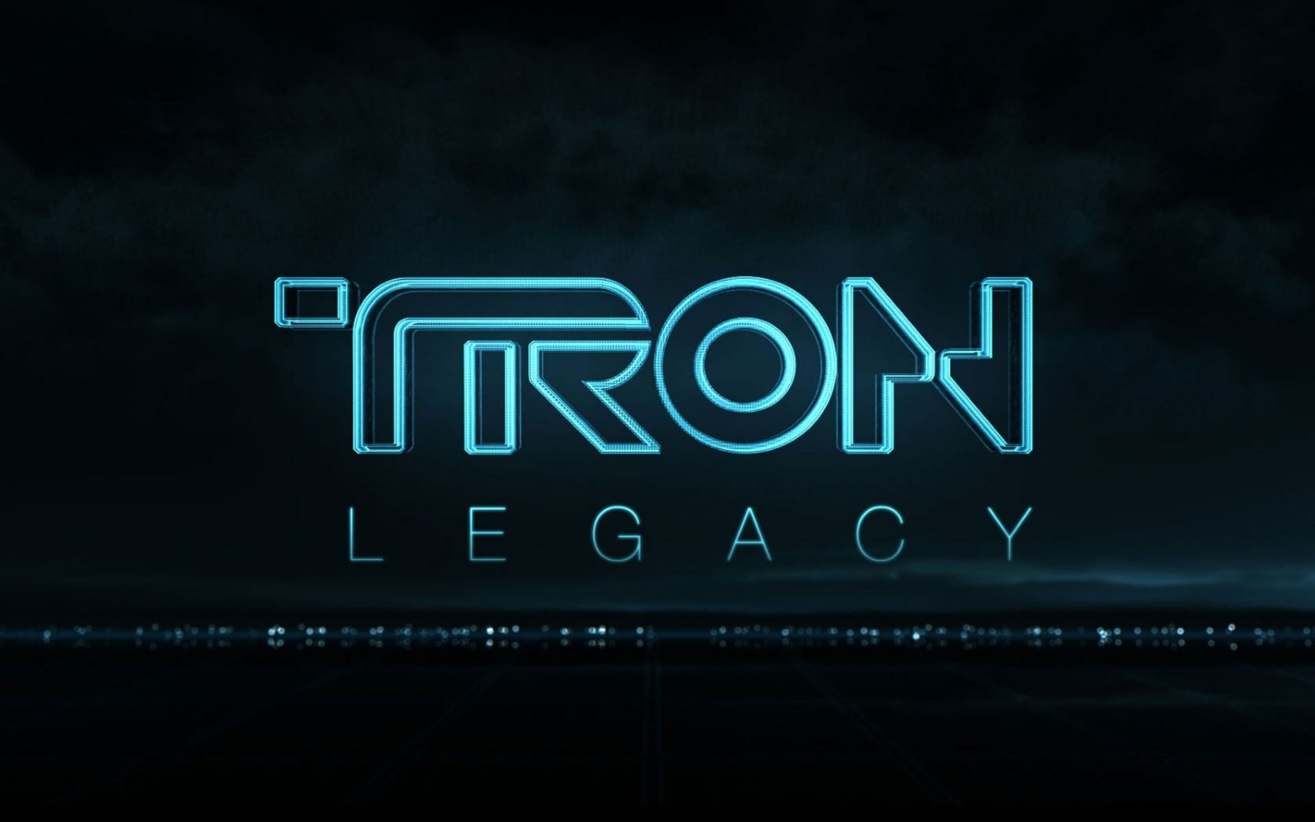 HD PC desktop wallpaper featuring the glowing blue logo of the movie TRON: Legacy against a dark background.
