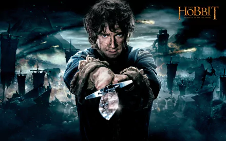 A dramatic HD wallpaper from The Hobbit: The Battle of the Five Armies, featuring a determined character brandishing a sword against a dark, tumultuous backdrop.