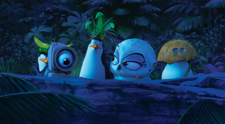 HD PC desktop wallpaper featuring the Penguins of Madagascar in a nighttime jungle scene, showcasing their animated characters from the movie.