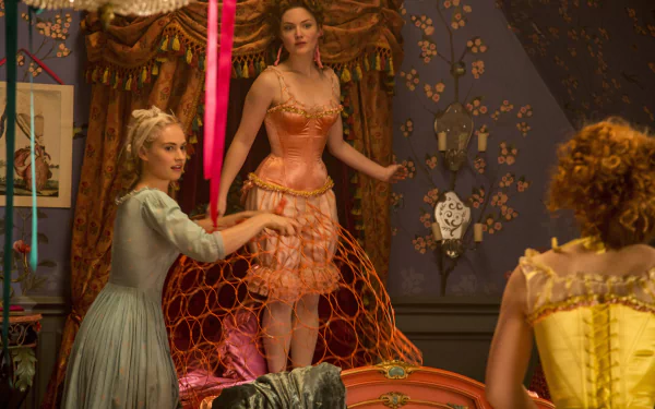 5K Ultra HD PC desktop wallpaper: a woman in a peach corseted gown stands on a bedframe in a richly decorated fairy-tale room as two others in period dresses watch.