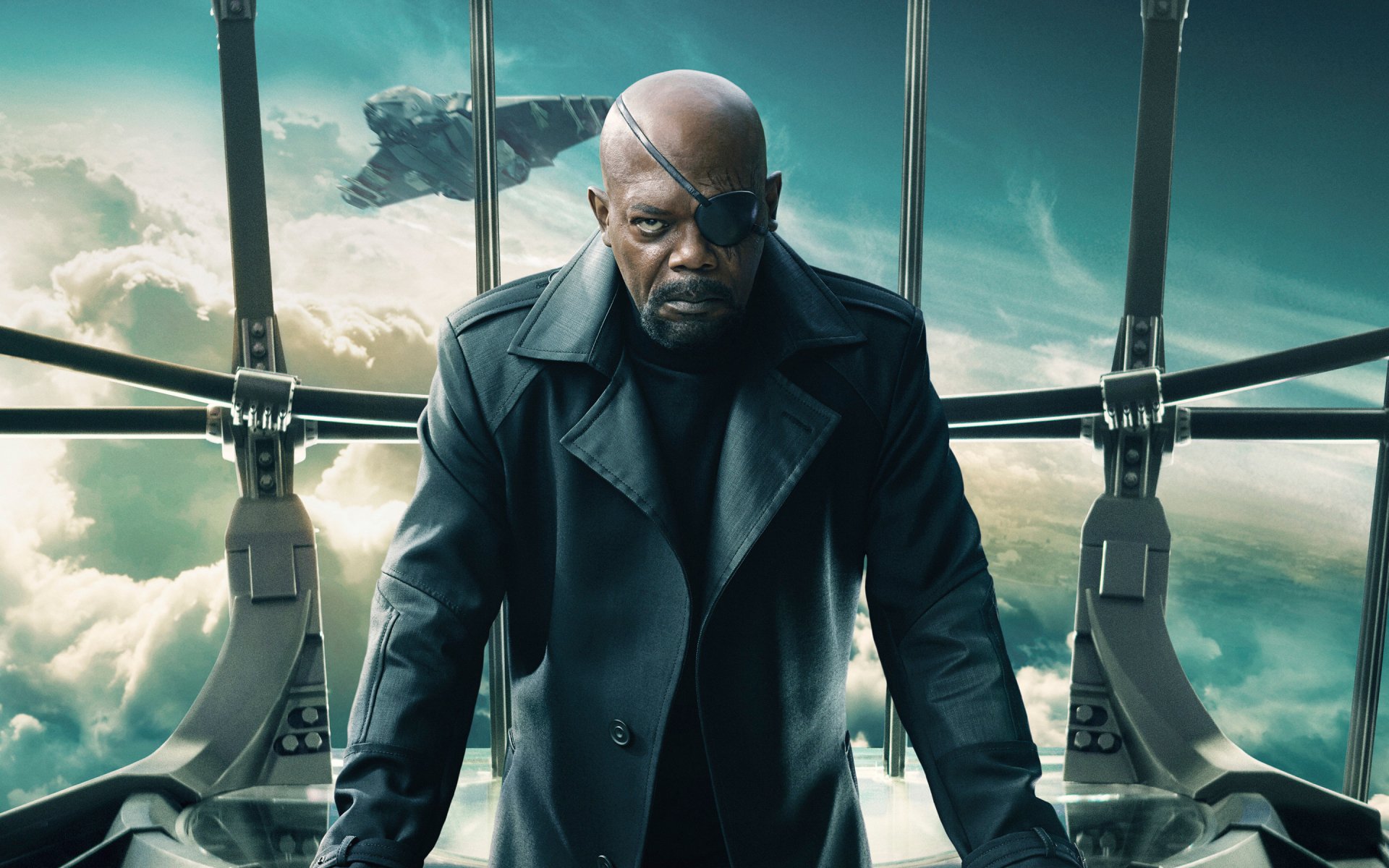 A dramatic HD wallpaper featuring Samuel L. Jackson as Nick Fury, wearing an eye patch, set against a dynamic background from Captain America: The Winter Soldier.