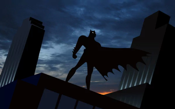 HD PC desktop wallpaper featuring Batman from Batman: The Animated Series standing on a rooftop against a dark, cloudy city skyline at dusk.