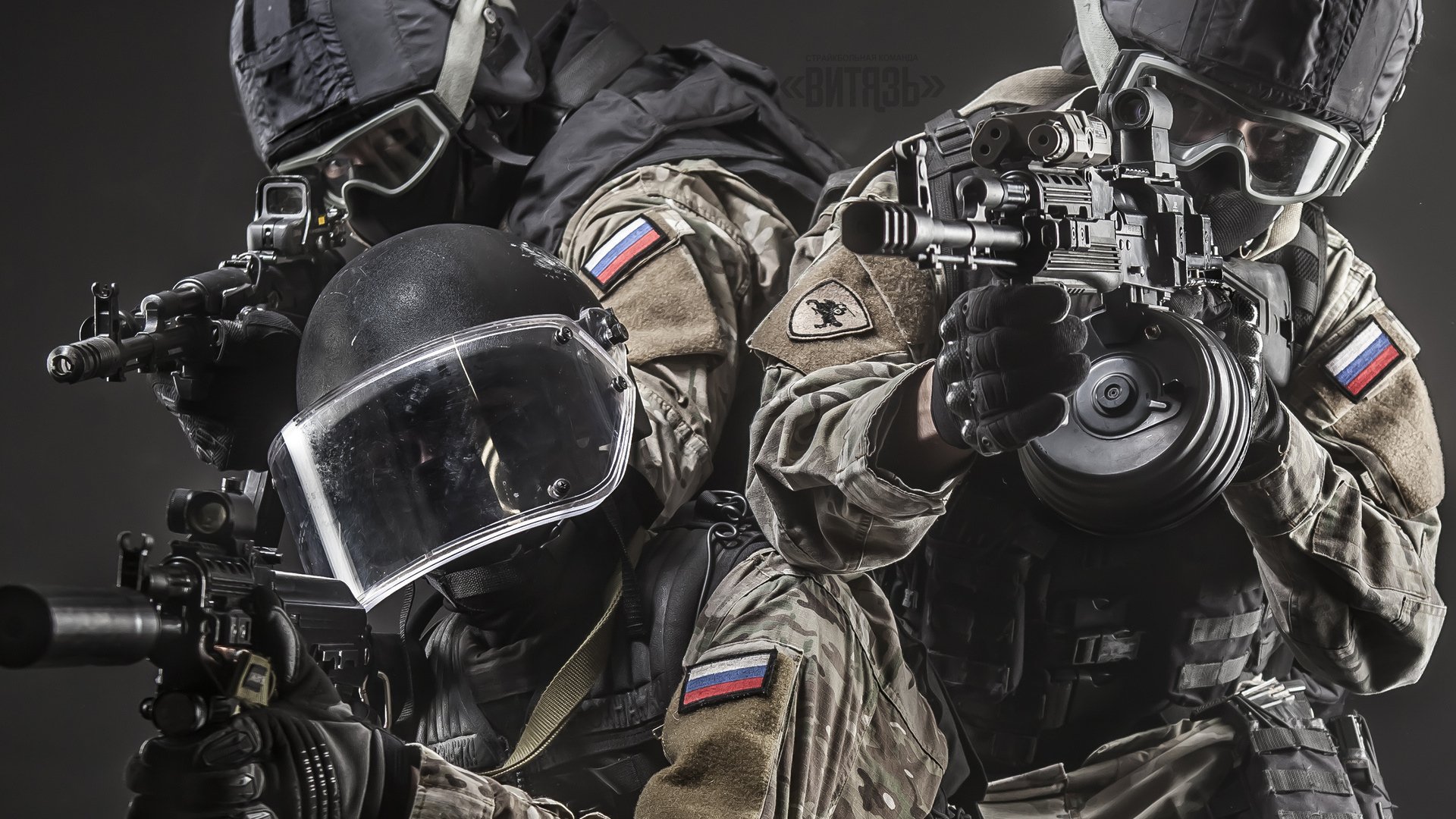 HD PC desktop wallpaper of military soldiers in tactical gear and helmets aiming rifles in a close-up, high-contrast action background.