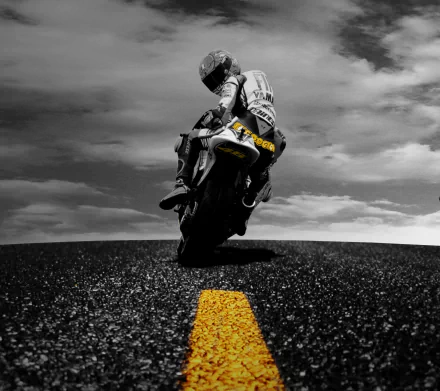 Valentino Rossi leans into a sharp turn on his motorcycle, set against a dramatic black-and-white background with a vibrant yellow line, creating a striking HD desktop wallpaper for sports fans.