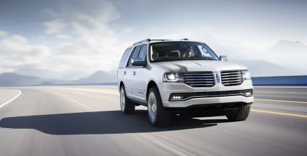 A white Lincoln Navigator SUV driving on a wide, open road under a cloudy sky, captured in 4K Ultra HD as a PC desktop wallpaper.