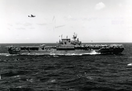 Black-and-white 4K Ultra HD image of the USS Enterprise (CV-6) aircraft carrier at sea, showcasing its military strength and naval design.