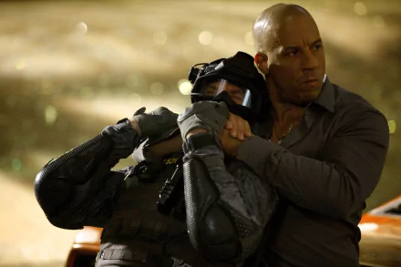 Dominic Toretto, portrayed by Vin Diesel, confronts an enemy in an intense scene from *Furious 7*, captured in this high-definition wallpaper.