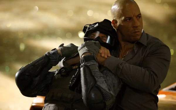 Dominic Toretto, portrayed by Vin Diesel, confronts an enemy in an intense scene from *Furious 7*, captured in this high-definition wallpaper.
